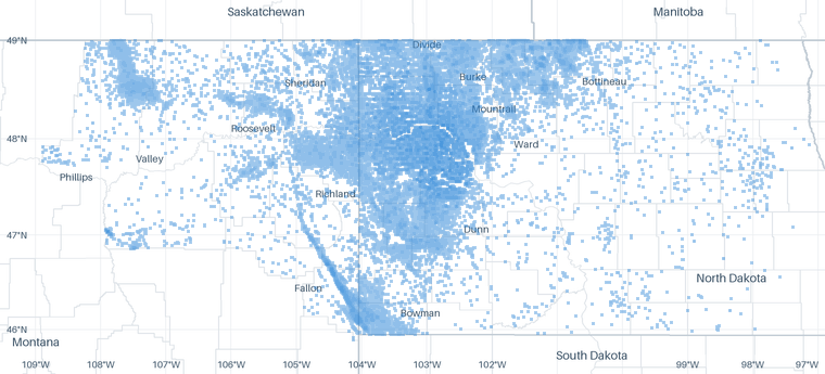 A map of 55,905 well locations inside the Bakken footprint for which CommoVision holds a published surface coordinate, each drawn where it is, over faint state, province, county and census-division outlines, place names and a latitude/longitude grid for orientation.