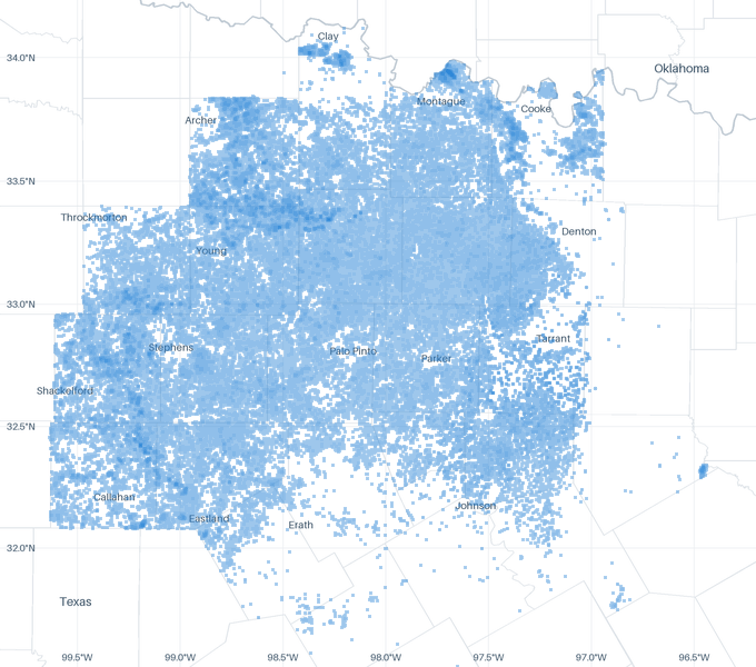 A map of 128,251 well locations inside the Barnett footprint for which CommoVision holds a published surface coordinate, each drawn where it is, over faint state and county outlines, place names and a latitude/longitude grid for orientation.