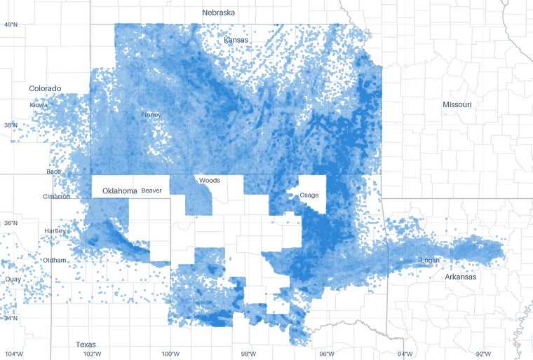 A map of 779,587 well locations inside the Mid-Continent footprint for which CommoVision holds a published surface coordinate, each drawn where it is, over faint state and county outlines, place names and a latitude/longitude grid for orientation.
