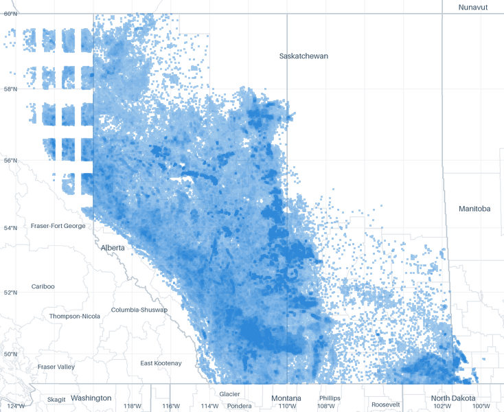 A map of 861,547 well locations inside the Western Canada footprint for which CommoVision holds a published surface coordinate, each drawn where it is, over faint state, province, county and census-division outlines, place names and a latitude/longitude grid for orientation.